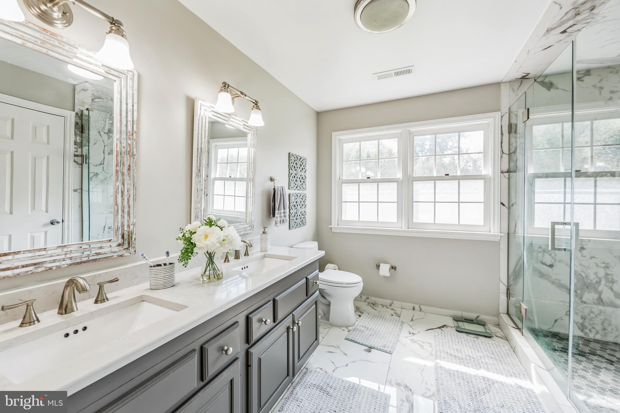 717 Evans Road Lower Gwynedd, PA 19002 - Photo 32 of 35 a bathroom with a granite countertop sink and a mirror