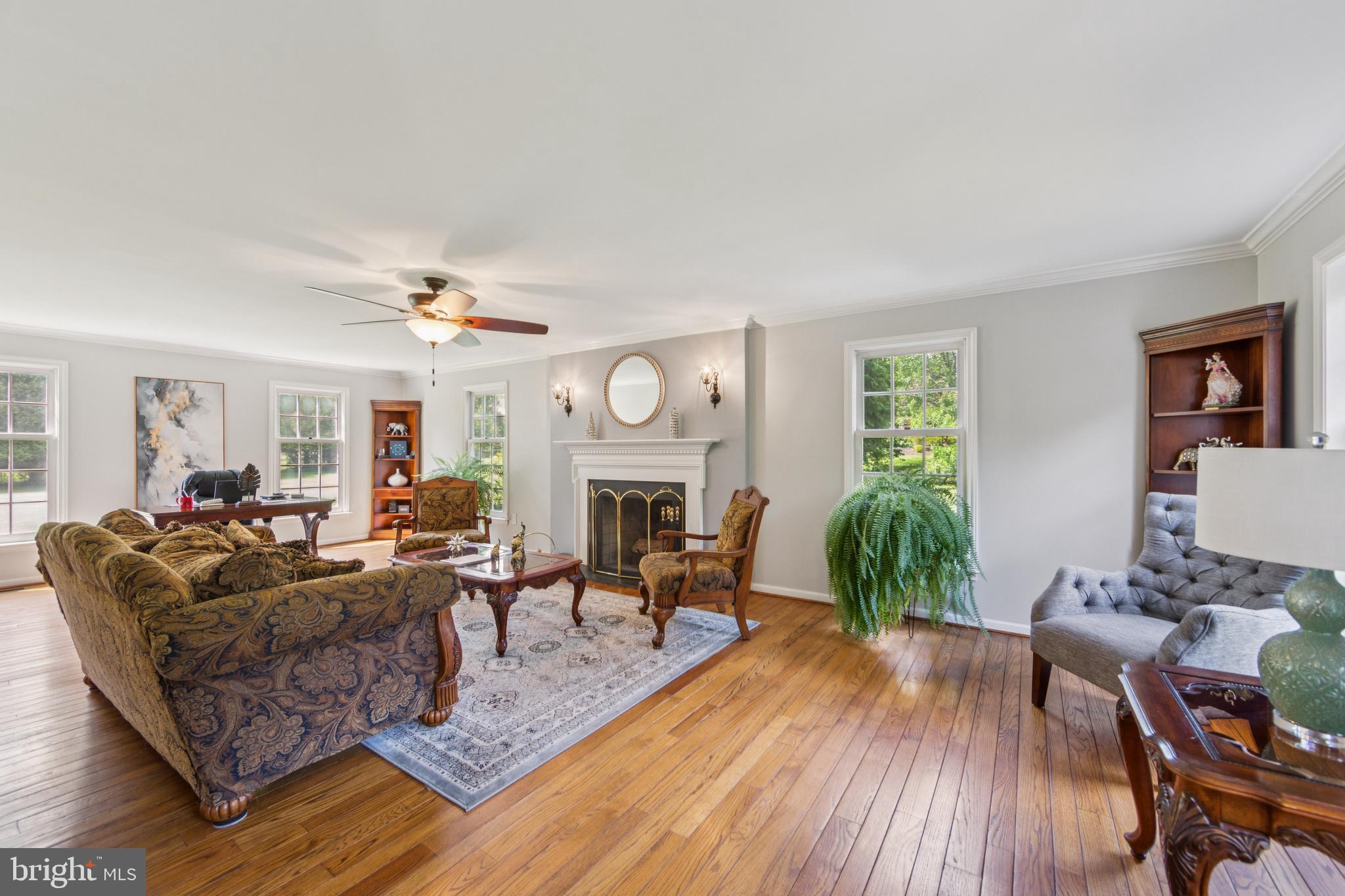 717 Evans Road Lower Gwynedd, PA 19002 - Photo 10 of 35 a living room with fireplace furniture and a wooden floor