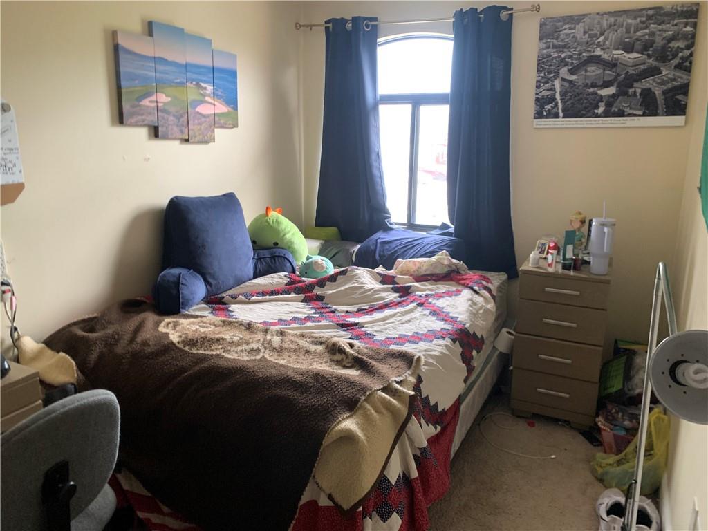 3246 Kennett Square Pittsburgh, PA 15213 - Photo 12 of 17 a bedroom with a bed and a window