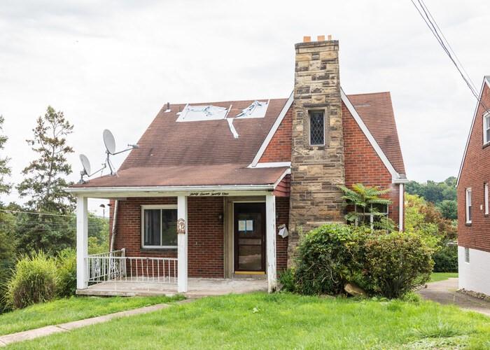 front view of a house with a yard