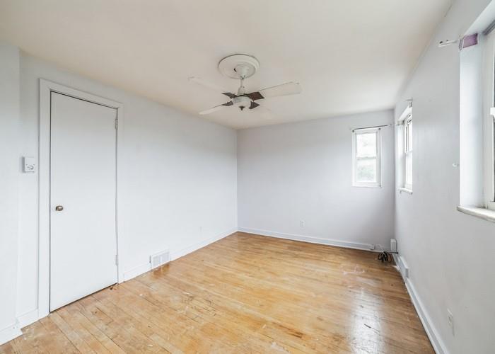 3721 Oakton Road Pittsburgh, PA 15227 - Photo 18 of 25 an empty room with windows and fan