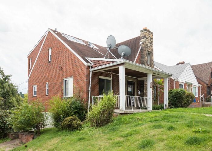3721 Oakton Road Pittsburgh, PA 15227 - Photo 5 of 25 a front view of a house with a yard