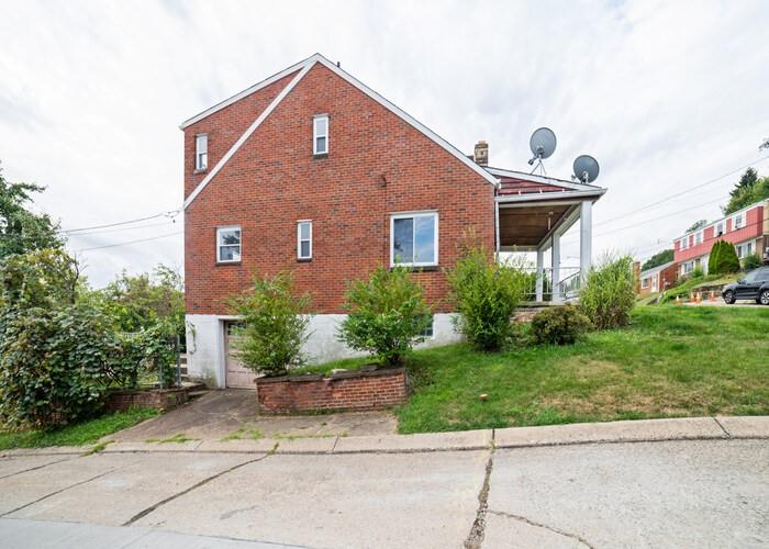 3721 Oakton Road Pittsburgh, PA 15227 - Photo 7 of 25 a front view of a house with a yard