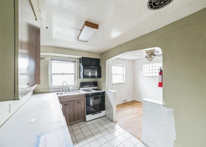 3721 Oakton Road Pittsburgh, PA 15227 - Photo 10 of 25 a kitchen with a sink cabinets and window