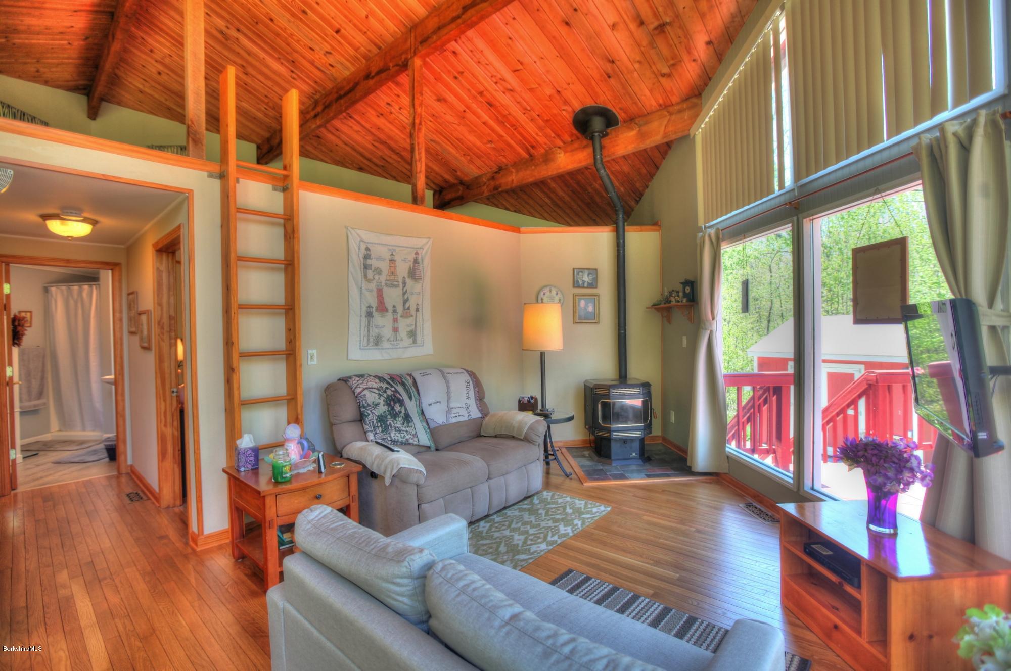 15 Dodd Road Sandisfield, MA 01255 - Photo 11 of 16 a outdoor living space with furniture and wooden floor
