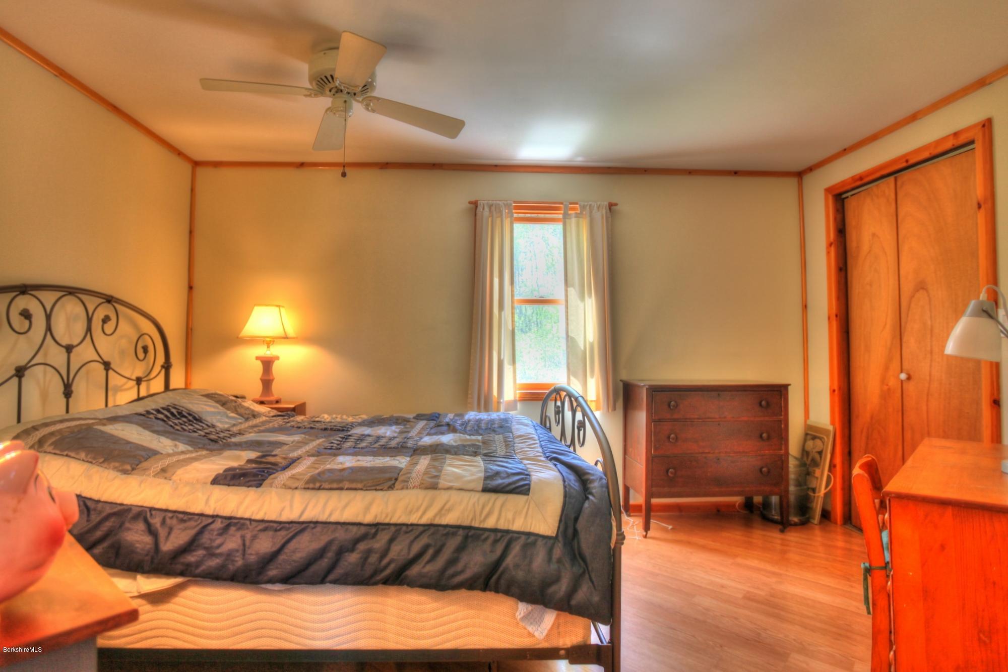 15 Dodd Road Sandisfield, MA 01255 - Photo 14 of 16 a bedroom with a bed and a window