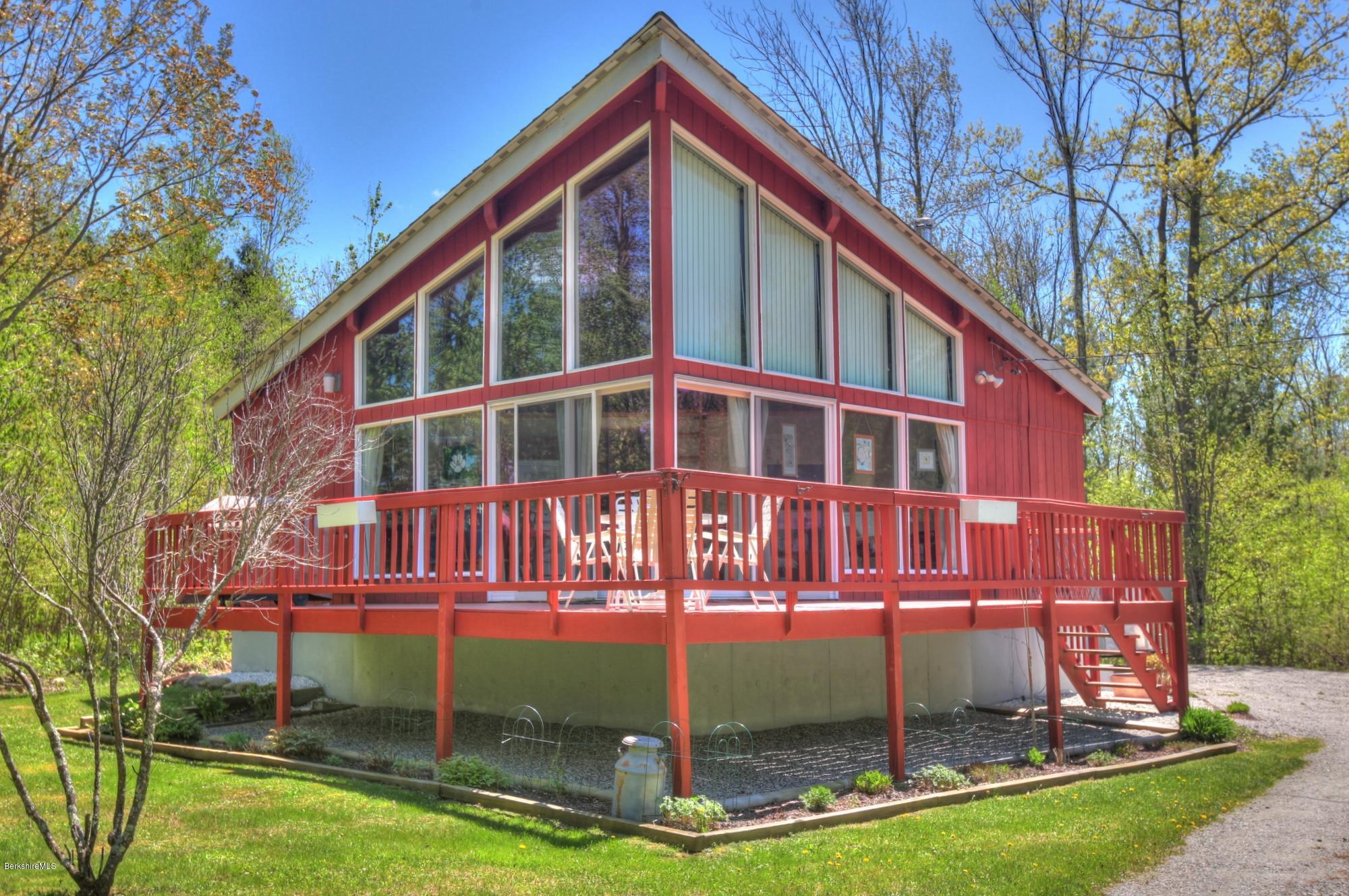 15 Dodd Road Sandisfield, MA 01255 - Photo 3 of 16 a front view of a house with a yard