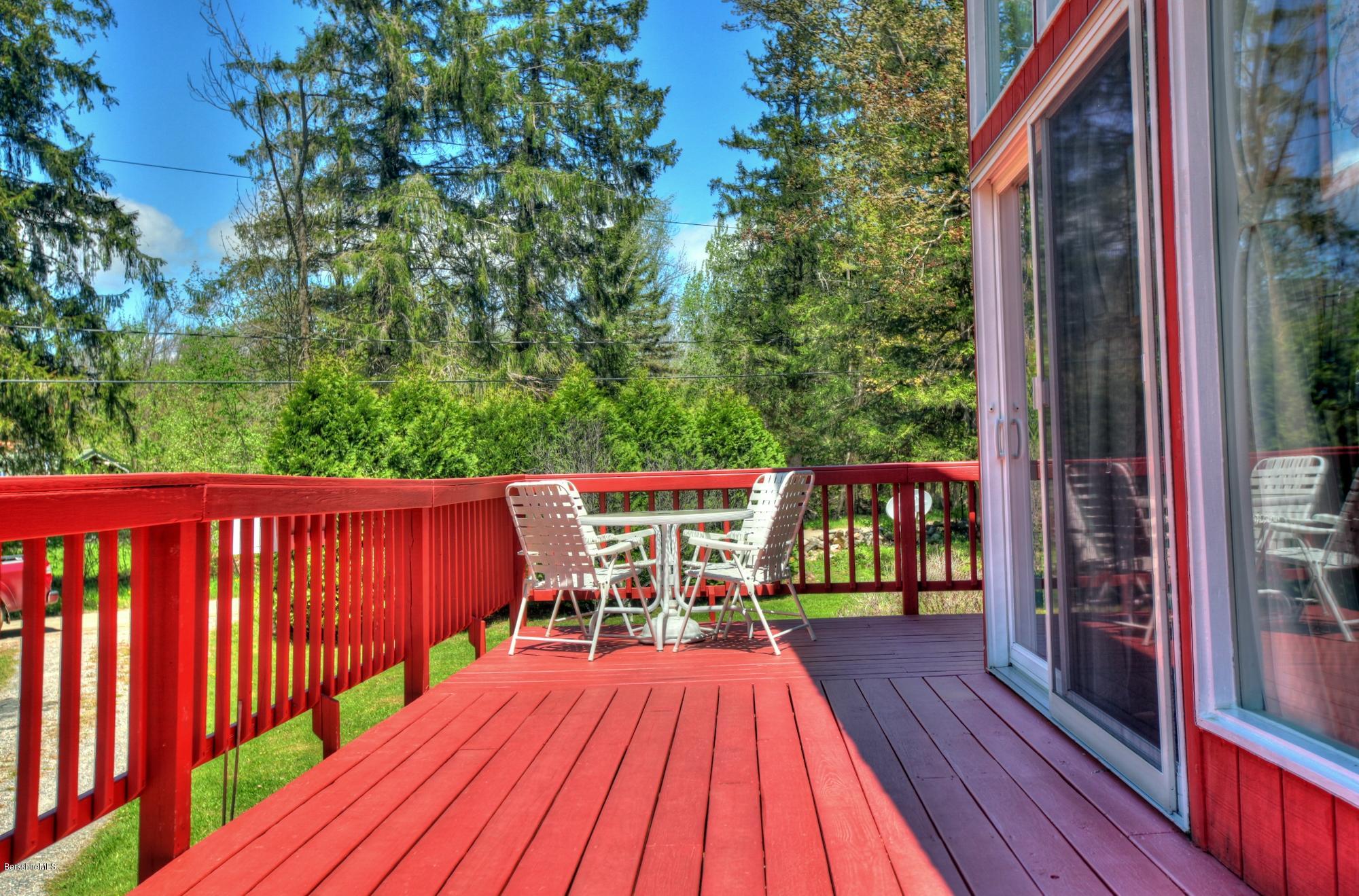 15 Dodd Road Sandisfield, MA 01255 - Photo 6 of 16 a view of balcony with wooden floor and outdoor seating