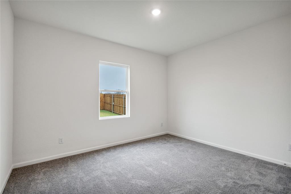 600 Merced River Lane Anna, TX 75409 - Photo 13 of 40 an empty room with a window