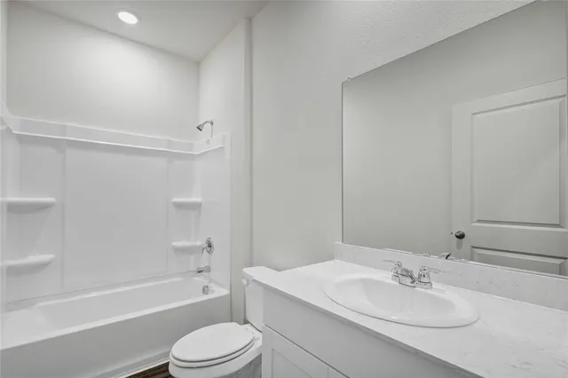 a bathroom with a sink toilet and bathtub
