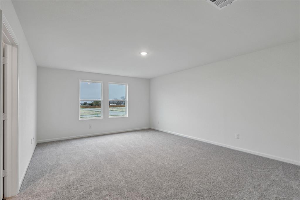 600 Merced River Lane Anna, TX 75409 - Photo 19 of 40 a view of an empty room with a window