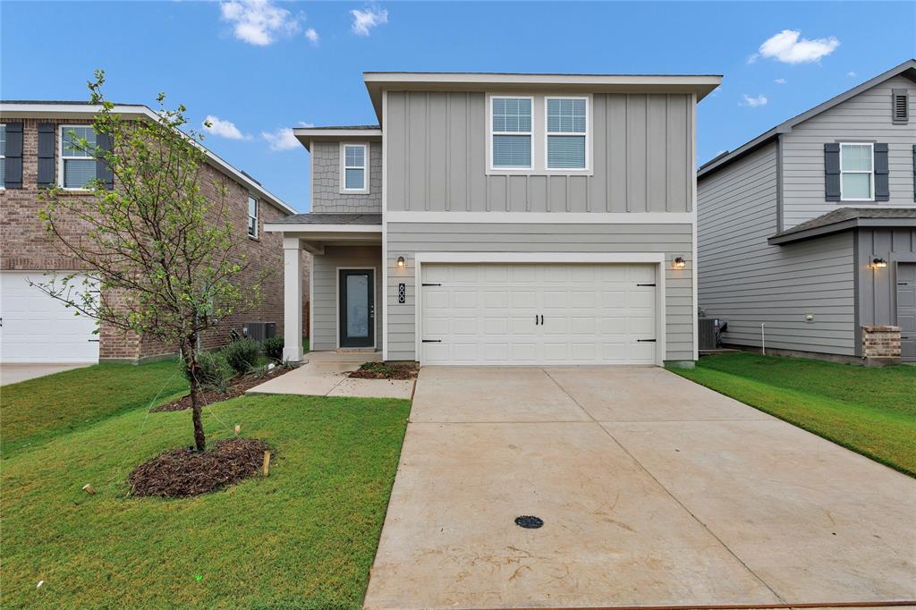 600 Merced River Lane Anna, TX 75409 - Photo 2 of 40 a front view of a house with a yard and garage