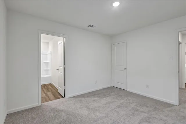 a view of a room that has a sink and glass door