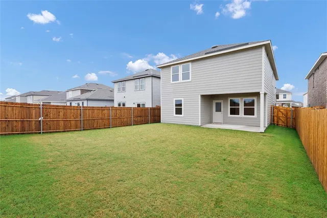 a view of a backyard of the house