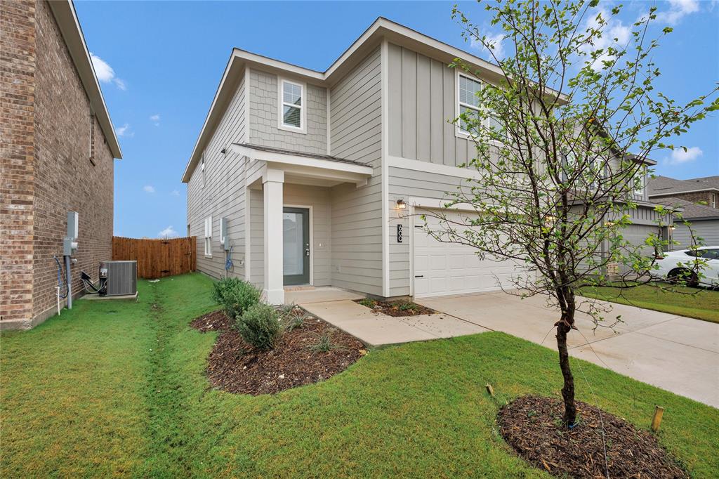 600 Merced River Lane Anna, TX 75409 - Photo 4 of 40 a front view of a house with garden