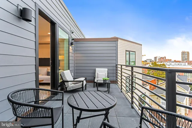 a view of outdoor sitting area with furniture