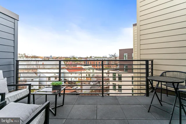 a view of a terrace with seating area