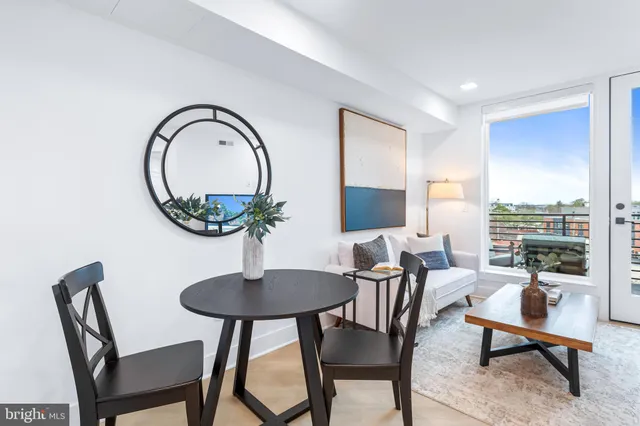 a work room with furniture and a potted plant