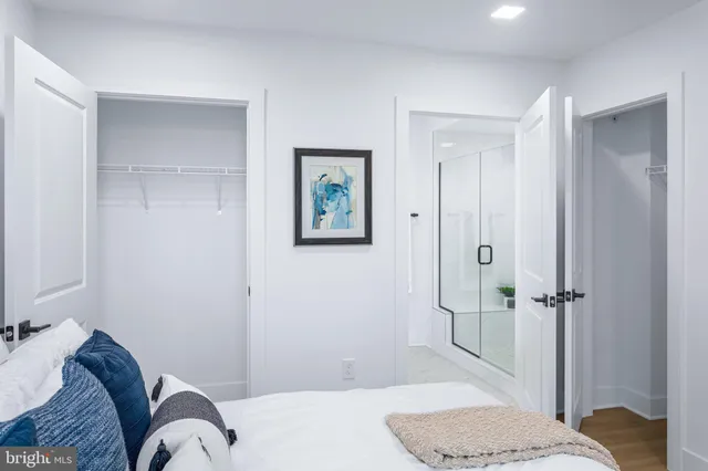 a bedroom with a bed and a shower