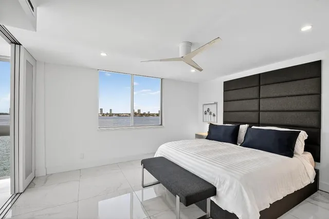 a bedroom with a bed and window