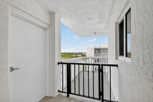 a view of a balcony from a hallway