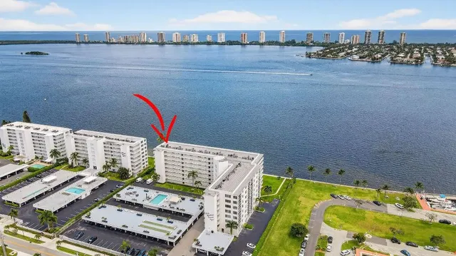 a view of a balcony with floor to ceiling windows