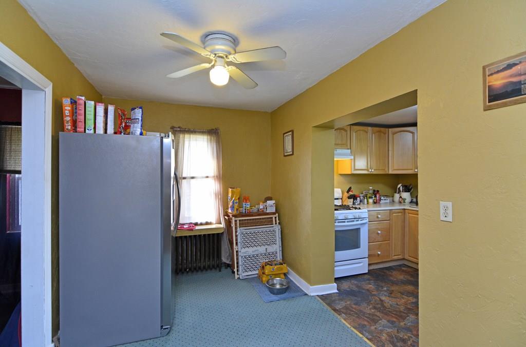 561 Keystone Street Pittsburgh, PA 15215 - Photo 5 of 10 The middle room between the kitchen and dining room is ideal for a refrigerator and storage.