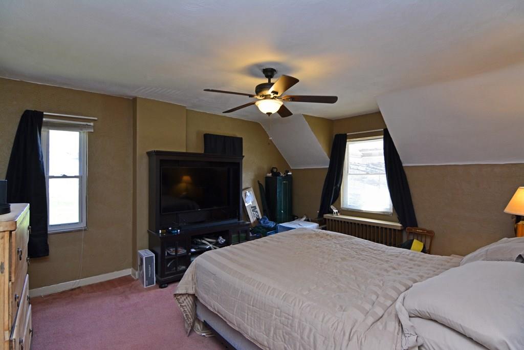 561 Keystone Street Pittsburgh, PA 15215 - Photo 7 of 10 The spacious master bedroom features a lighted ceiling fan.