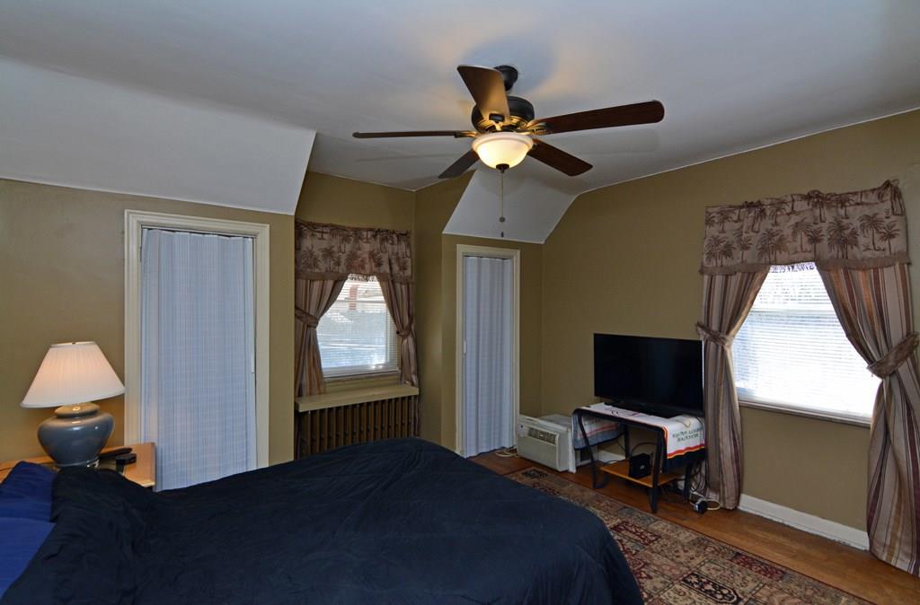 561 Keystone Street Pittsburgh, PA 15215 - Photo 8 of 10 The second bedroom offers hardwood flooring and dual closets.