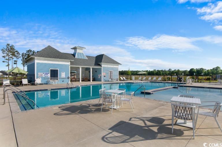 2162 Gooseberry Way Longs, SC 29568 - Photo 30 of 34 Community pool with a patio area