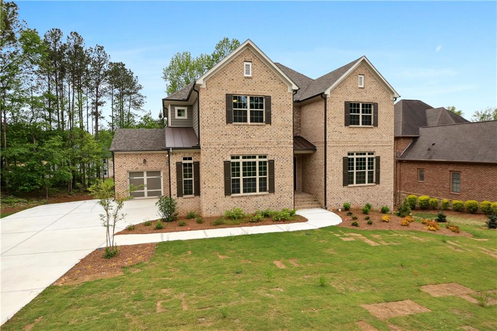 a front view of a house with a yard