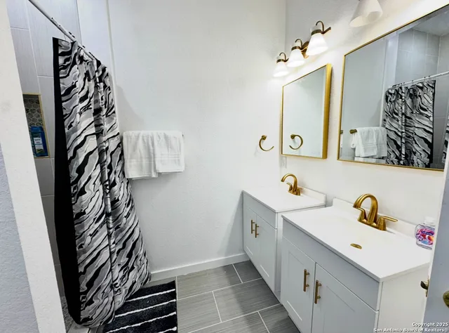 a bathroom with a sink and a mirror