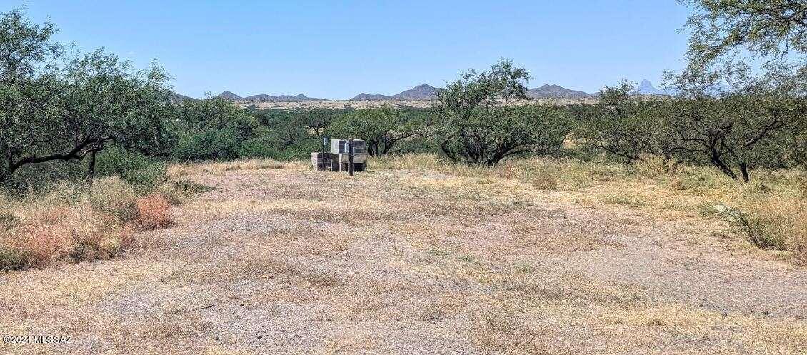 35700 South Cedar Creek Road Arivaca, AZ 85601 - Photo 16 of 44 a view of dirt road with a building in the background