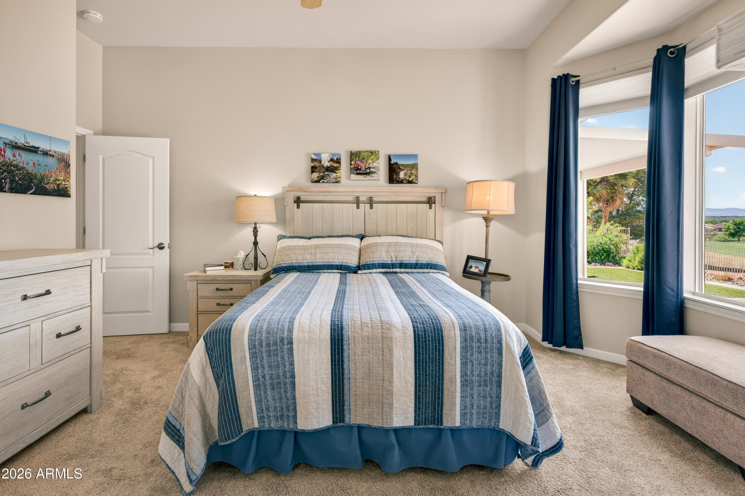 718 South Wandering River Road Cornville, AZ 86325 - Photo 20 of 41 a bedroom with a large bed and a window