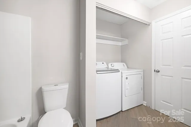 a view of bathroom with a washer and dryer