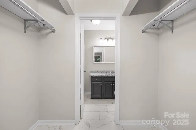 a bathroom with a sink and cabinets