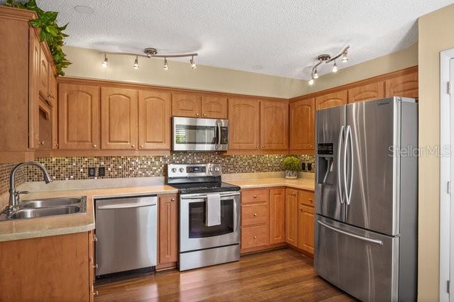 2 Misners Trail Ormond Beach, FL 32174 - Photo 11 of 44 a kitchen with stainless steel appliances a refrigerator sink and microwave