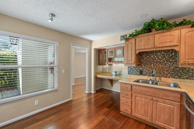 2 Misners Trail Ormond Beach, FL 32174 - Photo 12 of 44 a kitchen with a sink cabinets and window