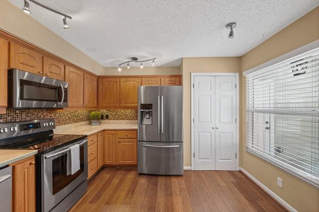 2 Misners Trail Ormond Beach, FL 32174 - Photo 13 of 44 a kitchen with a refrigerator stove and sink