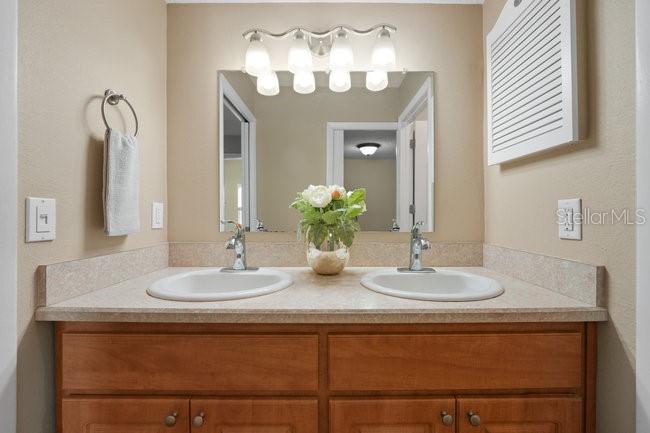 2 Misners Trail Ormond Beach, FL 32174 - Photo 16 of 44 a bathroom with a sink and a mirror