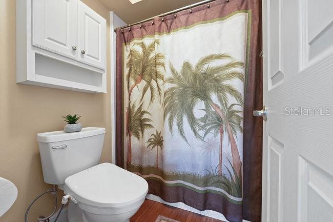 2 Misners Trail Ormond Beach, FL 32174 - Photo 18 of 44 a white toilet sitting next to a shower curtain