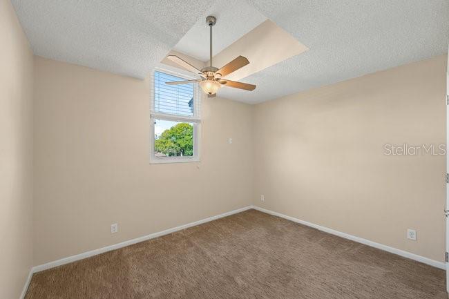 2 Misners Trail Ormond Beach, FL 32174 - Photo 23 of 44 an empty room with windows and fan