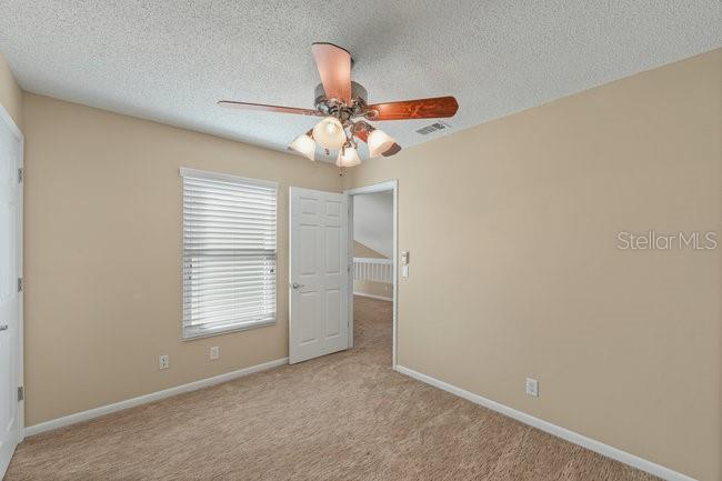 2 Misners Trail Ormond Beach, FL 32174 - Photo 26 of 44 an empty room with windows and fan