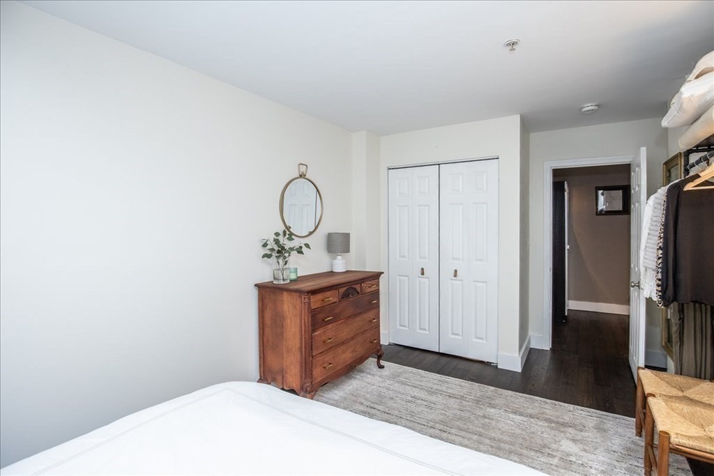 200 Market Street, Unit 3010 Lowell, MA 01852 - Photo 16 of 26 a view of hallway with sink and wooden floor