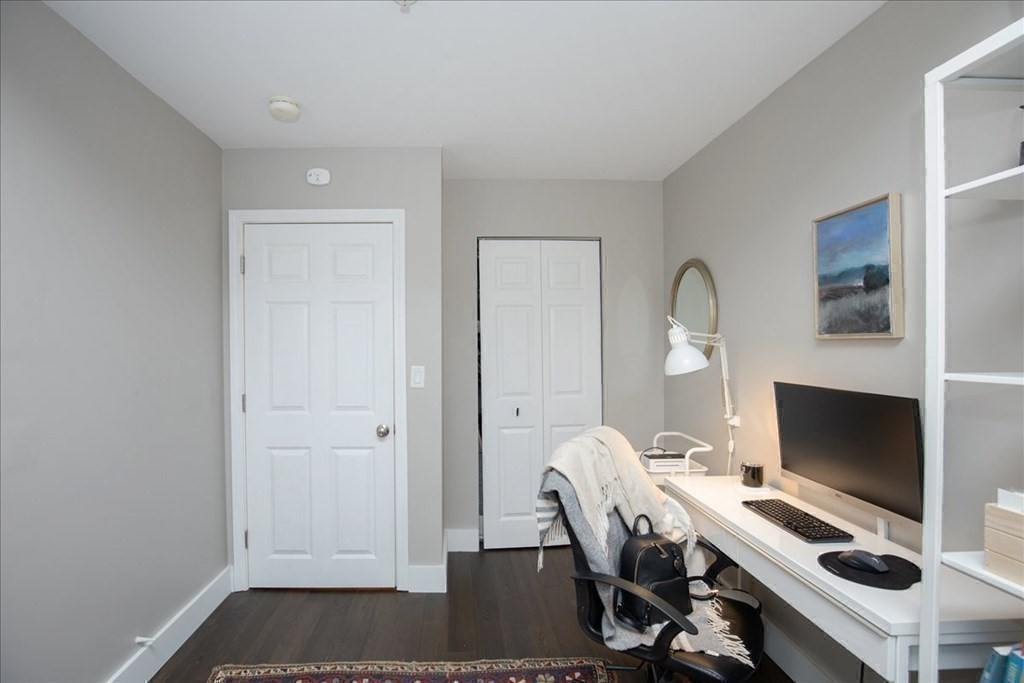 200 Market Street, Unit 3010 Lowell, MA 01852 - Photo 18 of 26 a view of a workspace with furniture and a window
