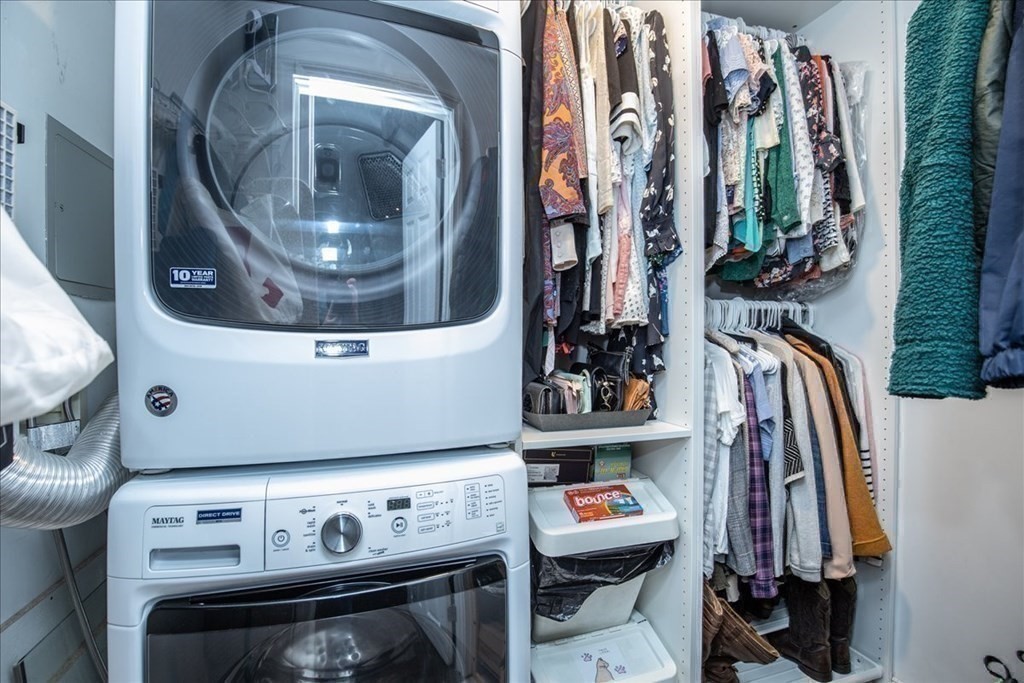 200 Market Street, Unit 3010 Lowell, MA 01852 - Photo 21 of 26 a view of walk in closet with clothes and shoes