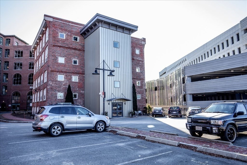 200 Market Street, Unit 3010 Lowell, MA 01852 - Photo 22 of 26 a car parked in front of a building