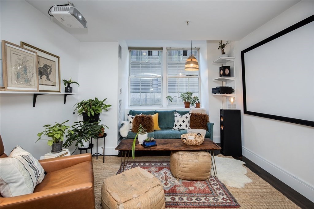 200 Market Street, Unit 3010 Lowell, MA 01852 - Photo 3 of 26 a living room with furniture and a potted plant