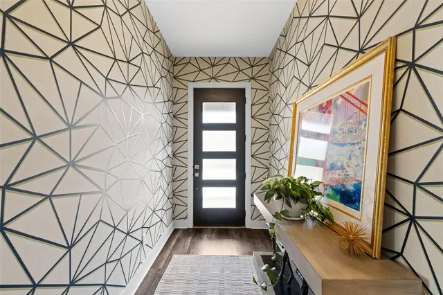 a view of entryway with flower pots