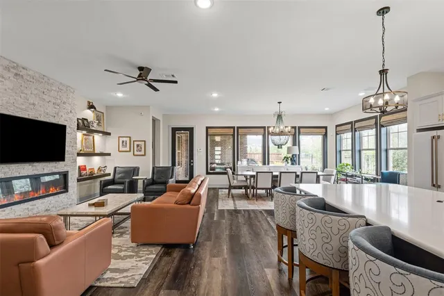 a living room with fireplace furniture and a flat screen tv